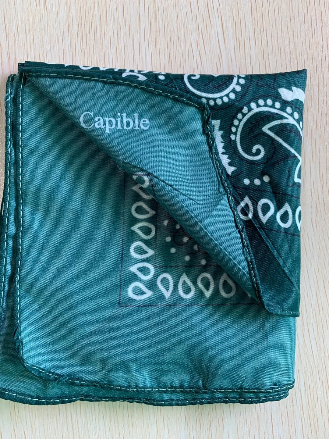 Capible Paisley square with melon seed flower dark green